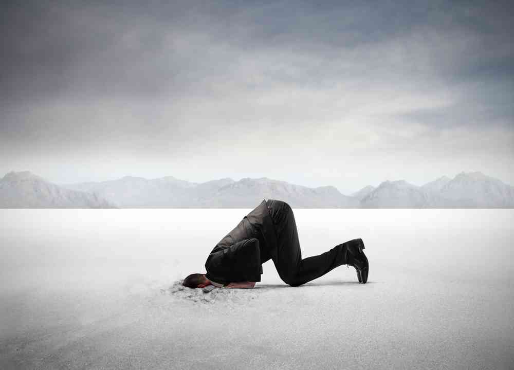 Businessman,Hiding,His,Head,In,The,Sand - Kevin O'Brien's Orthodontic Blog denial